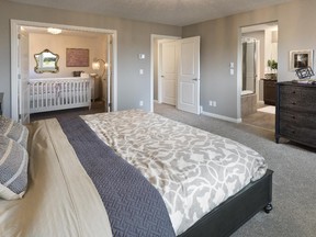 The master bedroom, with the private lifestyle room, in the Henderson show home by Morrison Homes in Symons Gate.