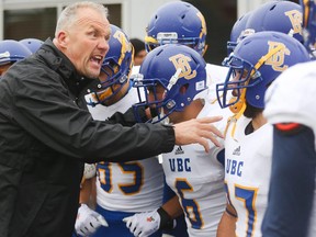 UBC head coach Blake Nill pumps up his team at McMahon Stadium in Calgary on Friday, Sept. 4, 2015. The University of Calgary Dinos football team hosted the University of British Columbia Thunderbirds in the home opening game of the 2015 season.