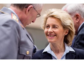German Defense Minister Ursula von der Leyen, right, smiles as she arrives for a meeting of NATO Defense Ministers with non-NATO ISAF Contributing Nations at NATO headquarters in Brussels on Thursday, Feb. 27, 2014. NATO defense ministers, in a second day of meetings, will discuss the situation in Ukraine and Afghanistan.