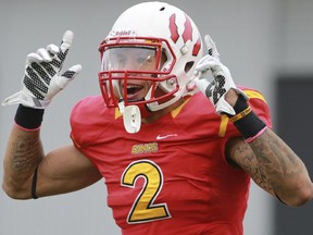 U of C Dinos receiver Rashaun Simonise celebrates after scoring a touchdown against the U of S Huskies earlier this month, one of eight he has on the season. He is also averaging the second most yards per game among all CIS receivers.