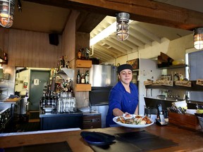 Chef Cora Babin serves up a platter at Big Fish.