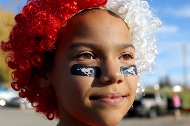 Calgary stampeders fan Naomi Voss, 11, gets ready for game action at McMahon Stadium as the Stampeders take on the Edmonton Eskimos in Calgary on October 10, 2015.