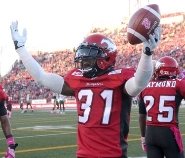 Calgary stampeders Brandon McDonald, celebrates his interception against the Edmonton Eskimos  during their game at McMahon Stadium in Calgary on October 10, 2015 .