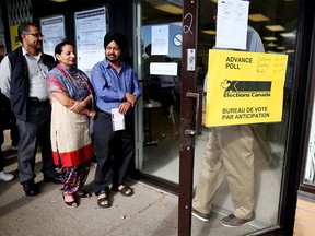 Calgarians line up outside a polling station in Forest Lawn during advance voting on Oct. 11, 2015.