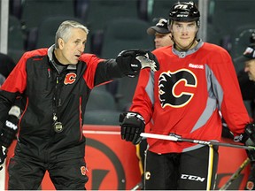 Calgary Flames head coach Bob Hartley gave instructions to the team during practice at the Scotiabank Saddledome on Oct. 12, 2015. The Flames are preparing to take on St. Louis on Tuesday.