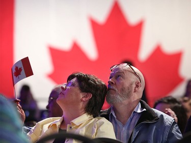 Supporters watch the results roll in at the Conservative HQ in Calgary on Oct. 19, 2015.