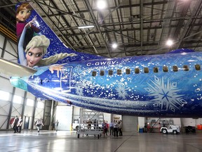WestJet unveils the newest Walt Disney WestJet airplane celebrating Frozen, in Calgary on Oct. 21, 2015.