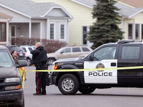 Calgary police investigate the scene of a suspicious death in the 0-100 block of Castledale Way N.E. Calgary on Monday afternoon.