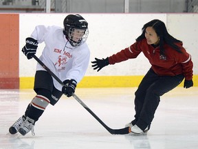 FILE PHOTO: Professional skating coach Kim Muir conducts one of her many "Can't Skate, Can't Play" power skating camps at the Treadwell Ice Arena in Juneau, Alaska on Friday, Sept. 25, 2015. Muir students have included members of the Detroit Red Wings, Carolina Hurricanes and the Swedish National Team, as well as youth, high school, college, semi-pro, professional and adult league hockey players. (Klas Stolpe/Juneau Empire via AP)