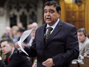 Conservative MP Deepak Obhrai stands in the House of Commons during question period in Ottawa, Friday, May 30, 2014. For a brief moment in history, Obhrai will be the man at the helm of the Conservative party caucus.THE CANADIAN PRESS/Fred Chartrand
