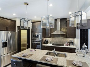 The kitchen in the Santa Fe 2 show home by Pacesetter by Sterling in Willows, Cochrane.