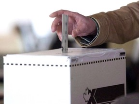 A man casts his vote for the 2011 federal election in this May 2, 2011 photo.