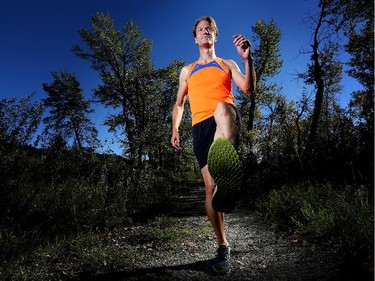 Ultramarathoner Dave Proctor runs the trails near his home in Black Diamond, Alberta on September 11, 2015.