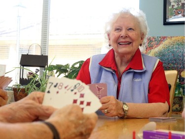 Ruby Friesen plays cribbage with her friends Vern Gallant, Harry Demers, and Shirley Ballard, not seen, at Silvera for Seniors in Calgary on October 28, 2015.