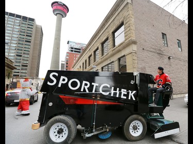 Calgary Flames forward Johnny Gaudreau drives a Zamboni down Centre Street in downtown Calgary on Tuesday as part of a promotion with Sport Chek to kick off the start of regular season hockey.