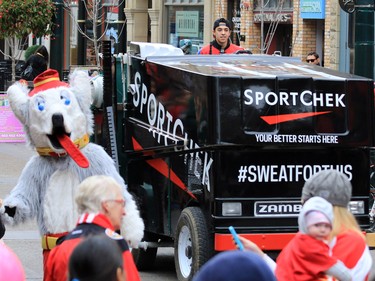 Calgary Flames forward Johnny Gaudreau drives a Zamboni down Stephen Avenue Mall in downtown Calgary on Tuesday as part of a promotion with Sport Chek to kick off the start of regular season hockey.