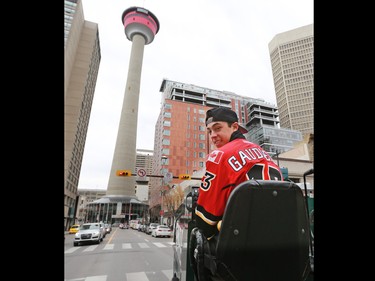 Calgary Flames forward Johnny Gaudreau drives a Zamboni down Centre Street in downtown Calgary on Tuesday as part of a promotion with Sport Chek to kick off the start of regular season hockey.