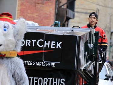 Calgary Flames forward Johnny Gaudreau drives a Zamboni down an alley towards Centre Street in downtown Calgary on Tuesday as part of a promotion with Sport Chek to kick off the start of regular season hockey.