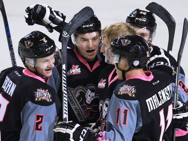 The Calgary Hitmen celebrate Jake Bean's goal against the Red Deer Rebels during first period WHL action at the Scotiabank Saddledome on Friday Oct. 9, 2015.