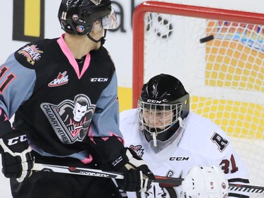 Calgary Hitmen Beck Malenstyn watches as the puck goes by Red Deer Rebels goaltender Rylan Toth during WHL action at the Scotiabank Saddledome on Friday Oct. 9, 2015. Jake Bean got credit for the first period goal.