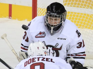 The puck goes by Red Deer Rebels goaltender Rylan Toth during WHL action at the Scotiabank Saddledome on Friday Oct. 9, 2015. Jake Bean got credit for the first period goal.