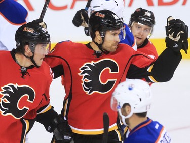 Calgary Flames Micheal Ferland, left and David Jones celebrate Jones' goal during the second period of NHL action at the Scotiabank Saddledome Saturday October 17, 2015.