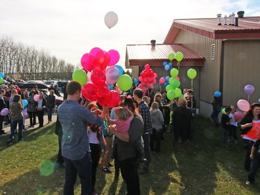 Several hundred people turned out at the Withrow Gospel Mission for prayer music and a balloon release in memory of the three Bott sisters; Catie, 13, Dara, 11, and Jana, 11,  who died in a tragic farm accident earlier this week.