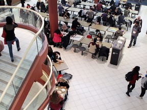 Students move through and hang out in the busy MacEwan Hall at the University of Calgary on Thursday, Nov. 7, 2013.