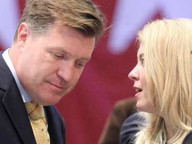 Pat Kelly, elected in Calgary Rocky Ridge, confers with Michelle Rempel who won her seat as well, at Conservative headquarters Monday night, Oct. 19, 2015.