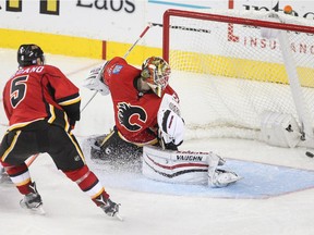 Former Flame Paul Byron scores for the Montreal Canadiens on Calgary netminder Joni Ortio as Mark Giordano trails on the play during the third period  at the Saddledome Friday evening October 30, 2015.