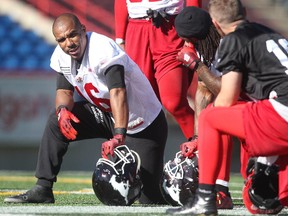 Calgary Stampeders receiver Marquay McDaniel chats with teammates, including quarteback Bo Levi Mitchell, during a lull in practice on Thursday.