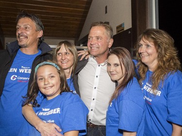 Conservative winner in Calgary-Confederation Len Webber, centre, takes celebratory photos with supporters after results are final on election night in Calgary, on Oct. 19, 2015.