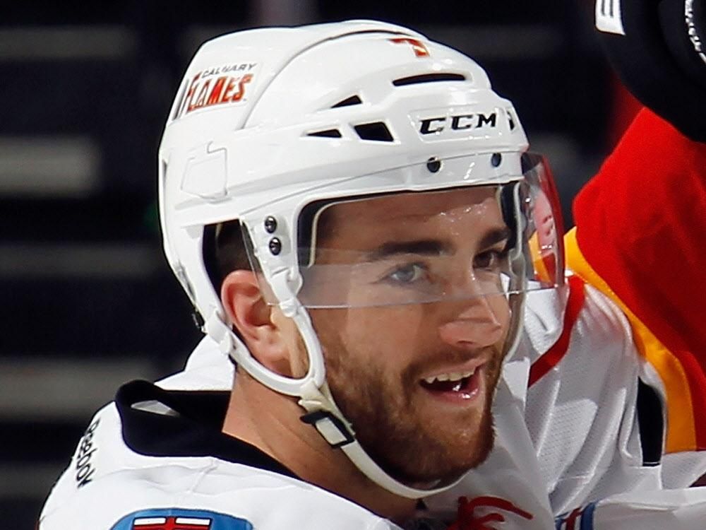 Flames notebook Brodie back Engelland and Smid shouldering the