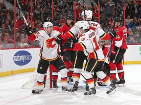 Sam Bennett, left, celebrates his first regular-season NHL goal in the third-period of Calgary's shootout loss to the Ottawa Senators on Wednesday.