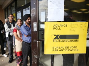 Calgarians line up outside a polling station in Forest Lawn during advance voting on Oct. 11. Reader says whoever wins on Monday, Canada will still be a great country.