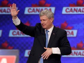 Prime Minister Stephen Harper reacts to losing the Federal Election at the Conservative HQ in Calgary on Oct. 19, 2015.