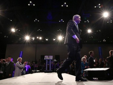 Prime Minister Stephen Harper leaves the stage after  his speech to the crowd at the Conservative HQ in Calgary on October 19, 2015 after losing the Federal Election.
