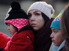 Jaci Cachene with some young family members at a candle light vigil for her sister Christa Cachene, on October 25, 2015 at Olympic Plaza. Christa was found beaten to death after a party at her house in Ranchlands.