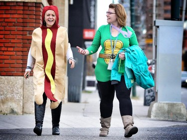 Joanna Piekarski, left, and Kristin Larson dressed up in their Halloween costumes for work Thursday at CUPS in Calgary October 29, 2015.