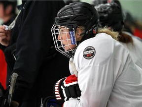 Hayley Wickenheiser rests between drills at the Calgary Inferno training camp at WinSport on Sunday. The Canadian women's hockey legend will  add to the team's already potent attack.