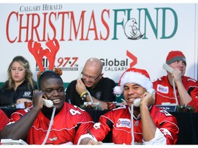Calgary Stampeders Mike Labinjo and Jon Cornish helped man the phones during the 2009 Give us a Jingle telethon at Chinook Centre. They joined celebrities who set a record to raise money for the Calgary Herald Christmas Fund.