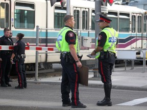 Calgary Police Service members were on the scene after a fatal pedestrian CTrain accident at the Chinook LRT station on Wednesday. Reader says it's time for an end to street-level tracks.