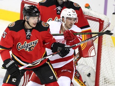 Calgary Flames defenceman Ladislav Smid guarded the crease against the Detroit Red Wings centre Darren Helm during first period NHL action at the Scotiabank Saddledome on October 23, 2015. The Flames were looking to break their home game losing streak.