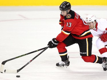 Calgary Flames left winger Johnny Gaudreau took off down the ice with the puck as Detroit Red Wings centre Darren Helm chased him during third period NHL action at the Scotiabank Saddledome on October 23, 2015. The Flames broke their home losing streak with the 3-2 overtime win over Detroit.