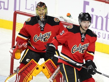 Colleen De Neve/ Calgary Herald CALGARY, AB -- OCTOBER 23, 2015 -- Calgary Flames defenceman Ladislav Smid guarded the crease infront of goalie Jonas Hiller against the Detroit Red Wings during first period NHL action at the Scotiabank Saddledome on October 23, 2015. The Flames were looking to break their home game losing streak. (Colleen De Neve/Calgary Herald) (For Sports story by Scott Cruickshank) 00068666A SLUG: 1024-Flames Red Wings