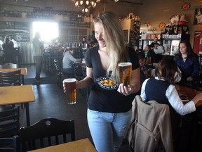 Ellie Forte is all smiles as she serves up draught at Wild Rose Brewery's Currie Barracks taproom.
