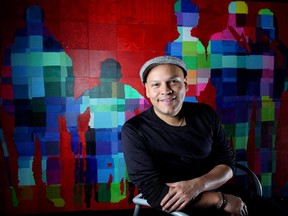 Wilmer Aburto, co-ordinator for the DEAMcanvas seen behind him at City Hall in Calgary on October 29, 2015. The giant canvas is part of the art project organized by Prospect Human Services for Disability Employment Awareness Month.