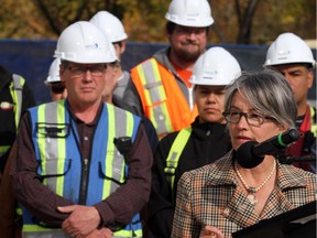 City Councillor Druh Farrell talks to media during a ground breaking that will  provide 5000 jobs for the near future with construction on Riverfront Avenue in Calgary on Oct. 1, 2015.