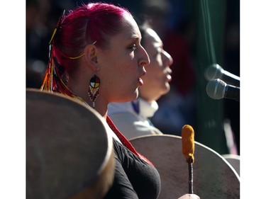 Chantal Chagnon, left, and her mom Cheryl Chagnon Greyeyes sing and drum at the Sisters In Spirit ceremony for missing and murdered aboriginal women on Oct. 5, 2015.