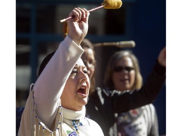 Cheryl Chagnon Greyeyes drums and sings at the Sisters In Spirit ceremony for missing and murdered aboriginal women Monday October 5, 2015 at Eau Claire. Dozens walked from City Hall to Eau Claire in the 11th annual march and ceremony.